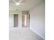Bright bedroom featuring neutral carpet, ceiling fan, and closet with door at 383 Blue Lake Cir, Kissimmee, FL 34758