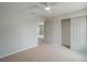 Bedroom with carpet, ceiling fan, closet, and doorways to other rooms at 383 Blue Lake Cir, Kissimmee, FL 34758