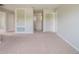 Spacious carpeted bonus room provides flexible living space with multiple doorways at 383 Blue Lake Cir, Kissimmee, FL 34758