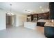 Spacious kitchen features an island, and dark cabinets. Perfect for gatherings at 383 Blue Lake Cir, Kissimmee, FL 34758