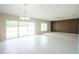 Open-concept living room, lots of natural light, and an accent wall at 383 Blue Lake Cir, Kissimmee, FL 34758