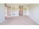 Upstairs hallway featuring neutral carpet and natural light at 383 Blue Lake Cir, Kissimmee, FL 34758
