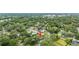 Expansive aerial view of the property nestled among lush greenery in a vibrant neighborhood setting at 1226 Se 9Th Ave, Ocala, FL 34471