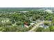 Aerial shot of the house nestled in a neighborhood with lots of trees and nearby businesses at 1226 Se 9Th Ave, Ocala, FL 34471