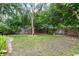 Serene backyard featuring mature trees and privacy fence for a tranquil outdoor space at 1226 Se 9Th Ave, Ocala, FL 34471