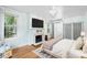 Bedroom with a marble fireplace, natural light and smooth hardwood flooring at 1226 Se 9Th Ave, Ocala, FL 34471