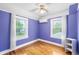 Bedroom featuring hardwood flooring, two bright windows and ceiling fan at 1226 Se 9Th Ave, Ocala, FL 34471
