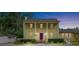 Classic yellow two-story home with a welcoming covered porch and well-maintained landscaping at 1226 Se 9Th Ave, Ocala, FL 34471