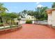 A home with brick driveway and mature landscaping at 1226 Se 9Th Ave, Ocala, FL 34471