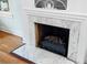 Close-up of a marble fireplace with a decorative mantel and grate at 1226 Se 9Th Ave, Ocala, FL 34471