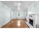 Bright living room with decorative fireplace, hardwood floors, and lots of light at 1226 Se 9Th Ave, Ocala, FL 34471