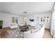 Cozy living room with modern furnishings, a stylish rug, and plenty of natural light at 1226 Se 9Th Ave, Ocala, FL 34471