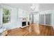 Inviting living room featuring a decorative fireplace and beautiful hardwood floors at 1226 Se 9Th Ave, Ocala, FL 34471