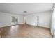 Open-concept living room boasting hardwood floors and access to the backyard at 1226 Se 9Th Ave, Ocala, FL 34471