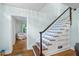 Charming staircase with hardwood steps, white risers, and built-in shelving for added character at 1226 Se 9Th Ave, Ocala, FL 34471