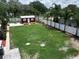 Lovely aerial view showcasing a spacious property with a home, shop, and pool at 1423 Spruce N Rd, Lakeland, FL 33809