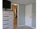 Bedroom featuring a dresser and open closet at 1423 Spruce N Rd, Lakeland, FL 33809