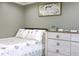 A bedroom with a decorative dresser and soothing ambiance at 1423 Spruce N Rd, Lakeland, FL 33809