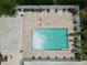 Birds eye view of a fenced in pool area with outdoor lounge furniture at 1423 Spruce N Rd, Lakeland, FL 33809
