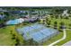 Overhead shot highlights community tennis courts, pool, and surrounding area at 2283 Geneva Dr, Lakeland, FL 33805