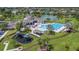 Aerial shot showcases playground, pool, and recreation area with lush landscaping at 2283 Geneva Dr, Lakeland, FL 33805