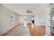 Bright bonus room with hardwood floors, ceiling fan, neutral paint, and large windows at 2283 Geneva Dr, Lakeland, FL 33805