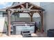 Backyard hot tub with wooden pergola offers a private relaxation space at 2283 Geneva Dr, Lakeland, FL 33805