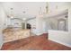 Bright, open kitchen with white cabinets, stone island, and stainless steel appliances at 2283 Geneva Dr, Lakeland, FL 33805