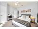 Cozy bedroom featuring a comfortable bed, neutral colors, and a workspace with a desk and chair at 3175 Feltrim Pl # 405, Kissimmee, FL 34747