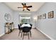 Bright dining area features a modern table, stylish chairs, and natural light from a sliding glass door at 3175 Feltrim Pl # 405, Kissimmee, FL 34747