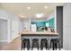 Stylish kitchen with modern cabinetry, breakfast bar seating, and stainless steel appliances at 3175 Feltrim Pl # 405, Kissimmee, FL 34747