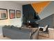 Comfortable living room with modern decor, stylish furniture, and a contemporary accent wall at 3175 Feltrim Pl # 405, Kissimmee, FL 34747