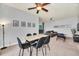 Open-concept living area showcases a modern dining table, comfortable seating, and stylish decor at 3175 Feltrim Pl # 405, Kissimmee, FL 34747