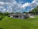 Aerial view of home showcasing the backyard, screened pool, and lush lawn at 3952 Laurel Branch Dr, Lakeland, FL 33810
