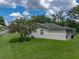 Expansive backyard featuring a screened patio and lush landscaping at 3952 Laurel Branch Dr, Lakeland, FL 33810