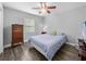 Bedroom featuring hardwood flooring, a ceiling fan, and a bright window at 3952 Laurel Branch Dr, Lakeland, FL 33810
