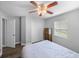 This inviting bedroom includes hardwood floors, ample closet space, and a fan at 3952 Laurel Branch Dr, Lakeland, FL 33810