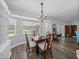 Bright dining area with table, complemented by lots of natural light from the window at 3952 Laurel Branch Dr, Lakeland, FL 33810
