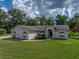 Beautiful single-story home with lush green lawn and mature trees in a serene setting at 3952 Laurel Branch Dr, Lakeland, FL 33810