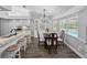 Modern kitchen with lots of windows and stainless steel appliances and bar seating at 3952 Laurel Branch Dr, Lakeland, FL 33810