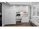 Bright kitchen features white cabinets, granite countertops, and stainless-steel microwave at 3952 Laurel Branch Dr, Lakeland, FL 33810