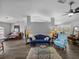 Open-concept living room featuring dark wood-look floors and comfortable seating at 3952 Laurel Branch Dr, Lakeland, FL 33810