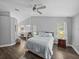 Bright main bedroom with vaulted ceiling and en suite bathroom featuring granite countertops and windows at 3952 Laurel Branch Dr, Lakeland, FL 33810