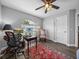 Home office with modern ceiling fan, large window, and ample storage space at 3952 Laurel Branch Dr, Lakeland, FL 33810