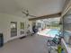 Relaxing outdoor patio with comfortable seating, an overhead fan, and a view of the pool at 3952 Laurel Branch Dr, Lakeland, FL 33810