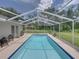 Sparkling screened-in pool with patio area and chairs offers a relaxing outdoor space at 3952 Laurel Branch Dr, Lakeland, FL 33810