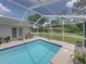Screened-in pool featuring patio seating, exterior access and a bright and airy feel at 3952 Laurel Branch Dr, Lakeland, FL 33810