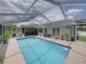 Spacious screened-in pool with outdoor seating and patio area perfect for entertaining at 3952 Laurel Branch Dr, Lakeland, FL 33810