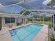 Relaxing screened-in pool featuring stairs, patio seating, and a bright and airy feel at 3952 Laurel Branch Dr, Lakeland, FL 33810