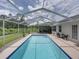 Inviting screened-in pool with a lounge area and green view perfect for outdoor relaxation at 3952 Laurel Branch Dr, Lakeland, FL 33810